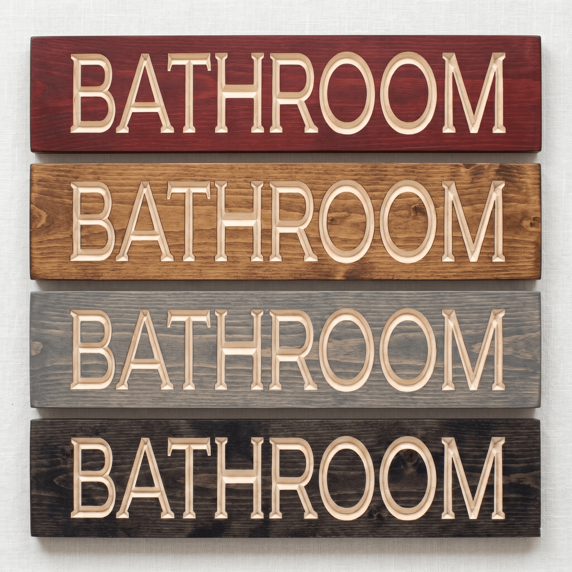 Bathroom wood sign shown in four stain finish options including cabernet, dark walnut, weathered gray, and ebony — CNC carved bathroom decor finish comparison from Bluegrass Gifts.