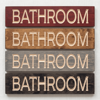 Bathroom wood sign shown in four stain finish options including cabernet, dark walnut, weathered gray, and ebony — CNC carved bathroom decor finish comparison from Bluegrass Gifts.