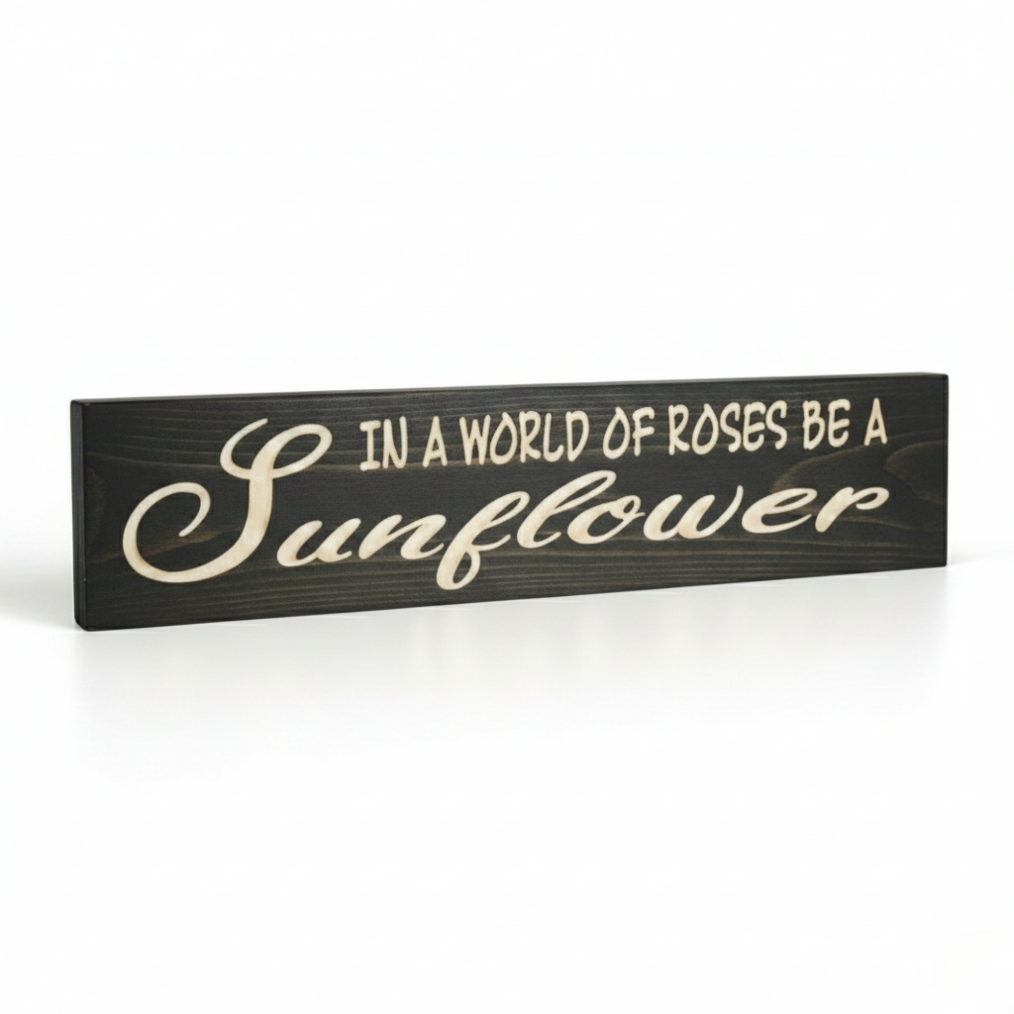 Angled view of the In a World of Roses Be a Sunflower wood sign showing the 3D depth of the CNC carving and solid wood thickness by Bluegrass Gifts.