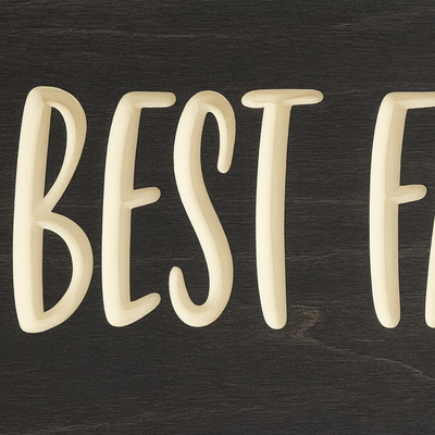 Close-up of engraved Best Family Ever wooden sign with rustic finish