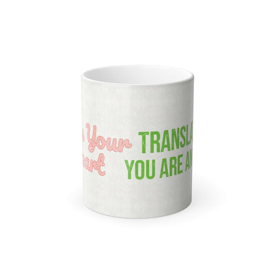 Front wrap design of Bless Your Heart translation magic mug with pink script and green you are an idiot text revealed when hot.