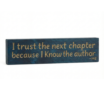 Angled wooden quote sign showing depth and edge, “I Trust the Next Chapter Because I Know the Author – Me,” farmhouse décor.