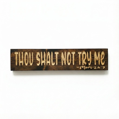Front view of the Bluegrass Gifts solid wood sign deeply carved with the phrase "Thou Shalt Not Try Me - Mom 24:7" in a dark walnut finish.