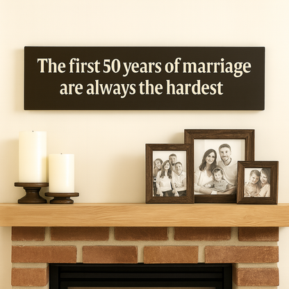 Rustic 50th anniversary sign styled above fireplace mantel with family photos and candles.