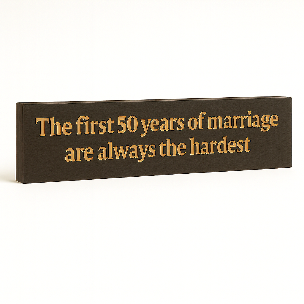 Angled studio shot of handcrafted wooden 50 years of marriage wall sign.