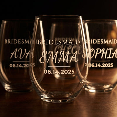 Close-up of the etched BRIDESMAID name and wedding date on a stemless wine glass