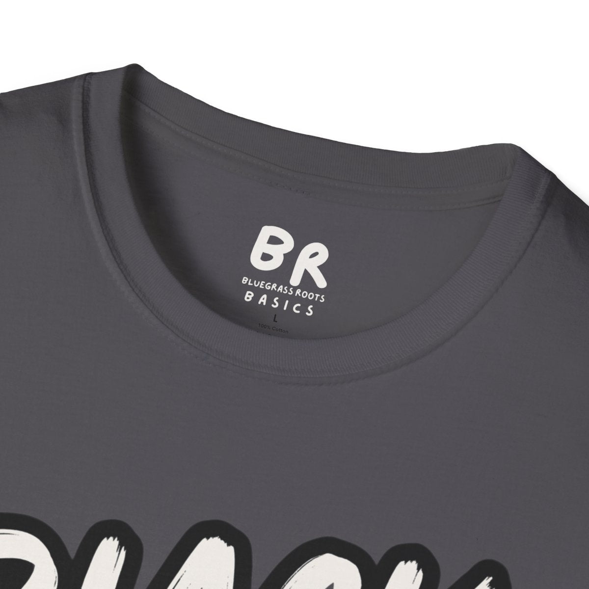 A close-up of the dark gray Cattle Shirt - Black Baldy neck label, showing "BR Bluegrass Roots Basics" and part of the graphic,