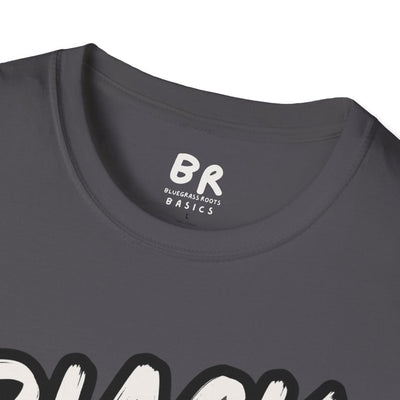 A close-up of the dark gray Cattle Shirt - Black Baldy neck label, showing "BR Bluegrass Roots Basics" and part of the graphic,