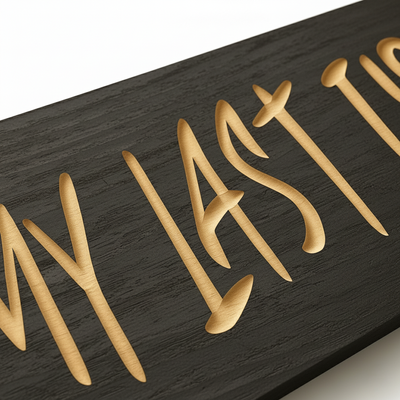 Close-up of V-carved lettering on the “You’re My Last First Kiss” solid wood sign, showing depth and craftsmanship.
