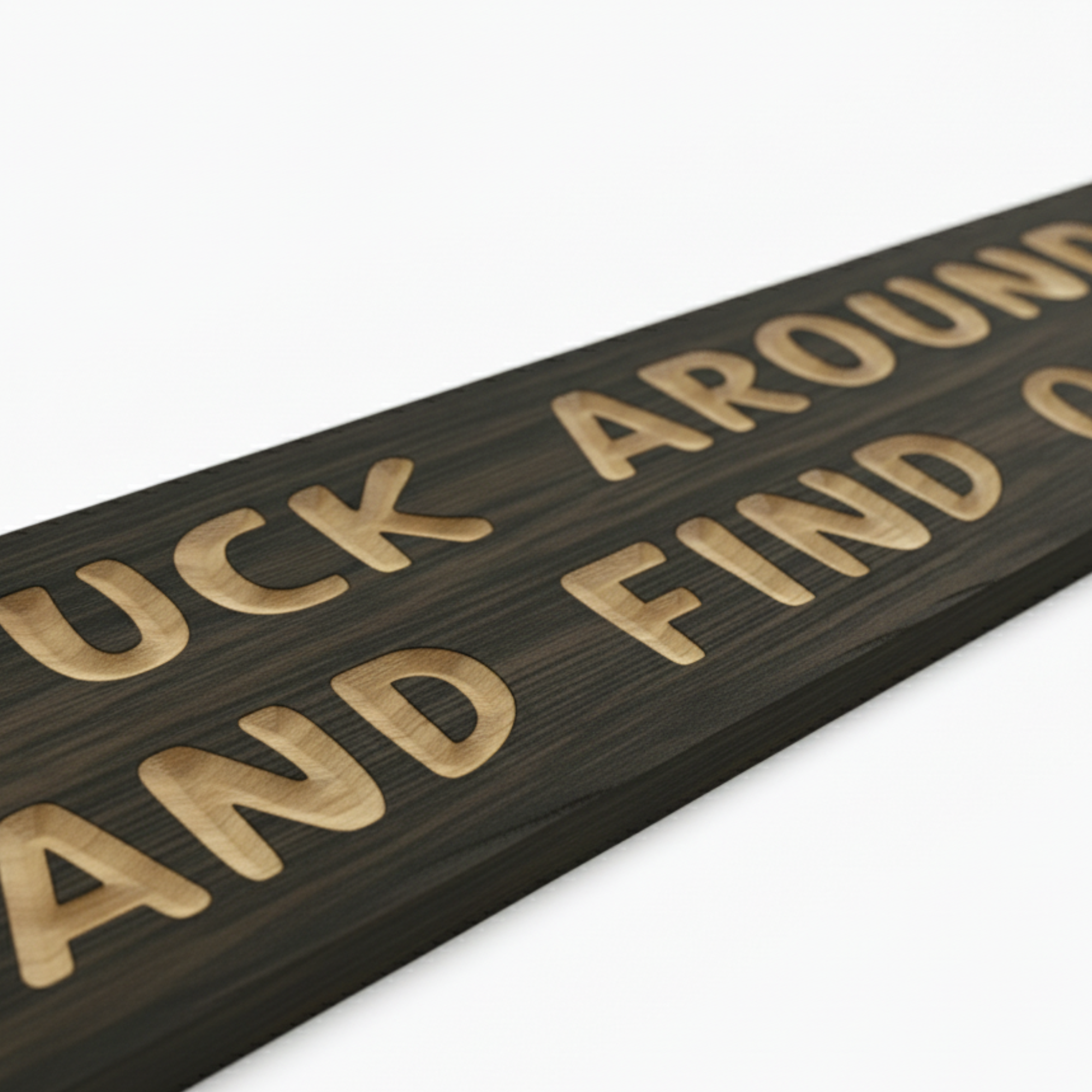 A close-up macro shot of a FAFO sign, highlighting the deep, clean CNC carving of the letters into the dark wood grain.
