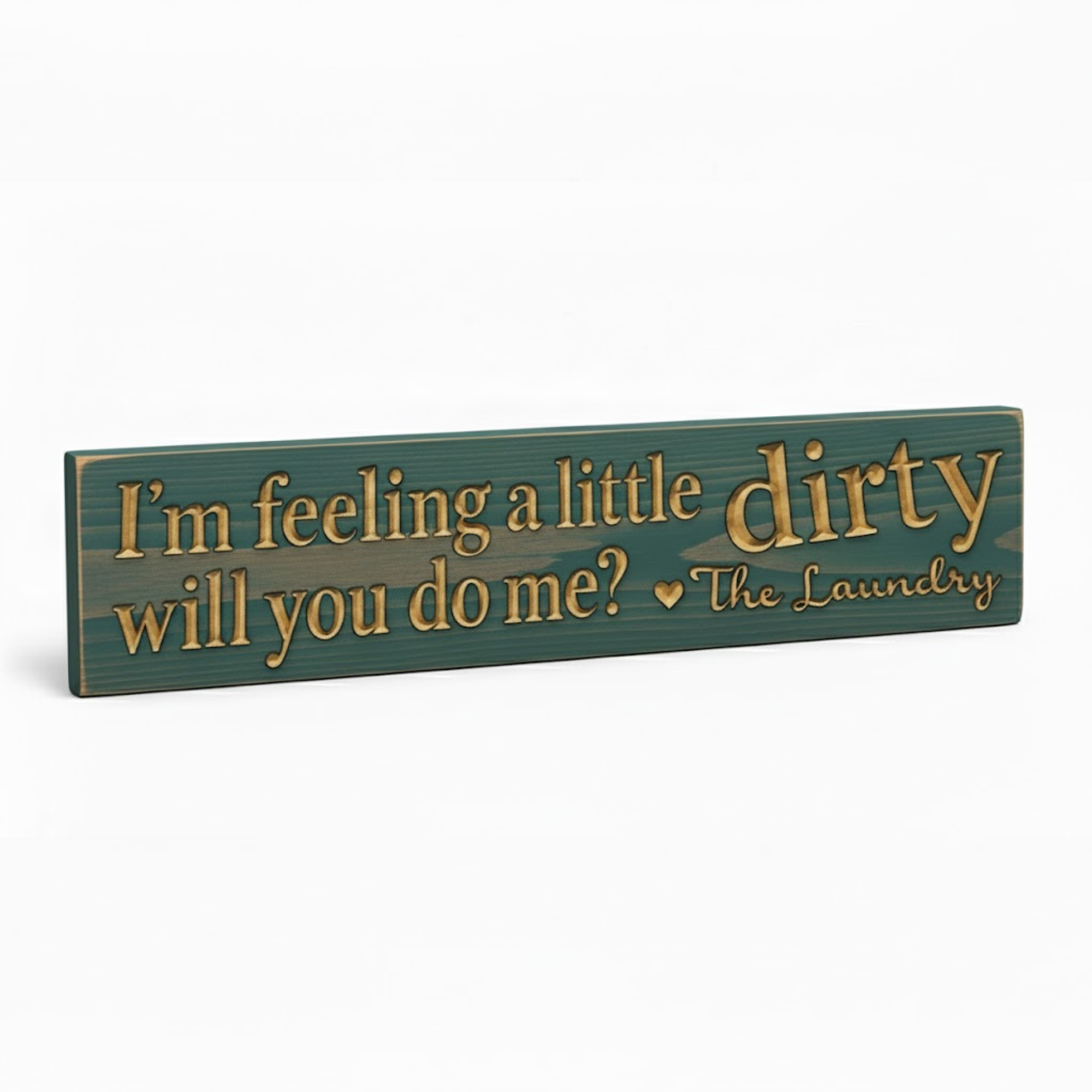 Angled view of the funny laundry room sign, highlighting the 3D texture of the CNC-carved letters in solid wood.