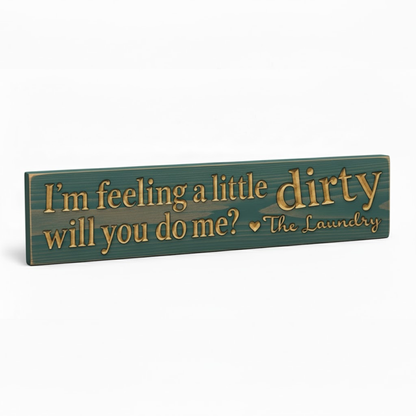 Angled view of the funny laundry room sign, highlighting the 3D texture of the CNC-carved letters in solid wood.