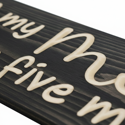 Extreme close-up of premium CNC V-carving on solid wood, highlighting the tactile texture and high-contrast visibility.