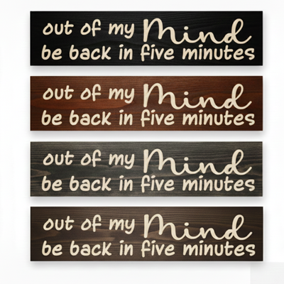 Four "Out of My Mind" signs displayed in different finishes including Ebony, Dark Walnut, Weathered Gray, and Barn Red.