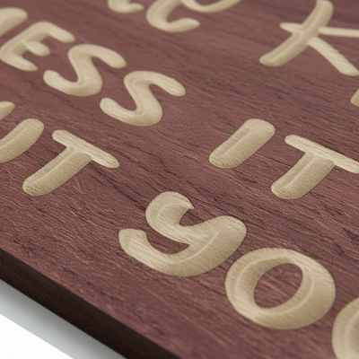 A close-up detail shot of a sarcastic wood decor sign, highlighting the deep, three-dimensional CNC carving of the letters.