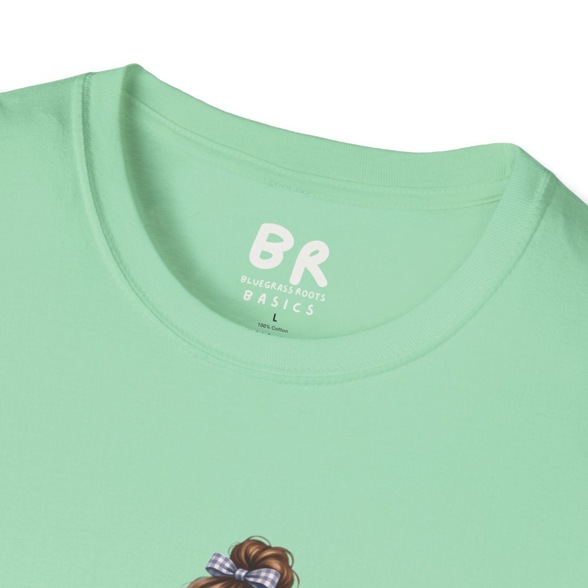 A close-up of the collar of the light green Dog Mom Shirt - Fur Mama, showing the Bluegrass Roots Basics brand label