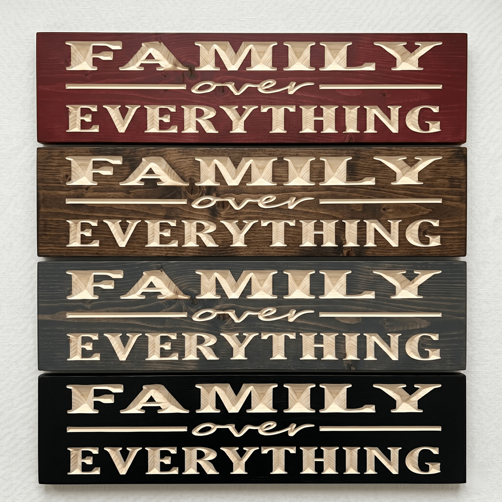 Four Family Over Everything CNC-carved wood signs stacked to show stain options including Cabernet, Dark Walnut, Weathered Gray, and Ebony