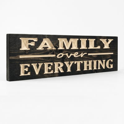 Angled view of the Family Over Everything rustic wood sign showing dimensional CNC-carved letters on solid Pine with deep ebony stain