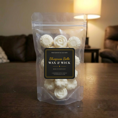 Clear stand-up pouch of rose and daisy wax melts with the Bluegrass Belle label