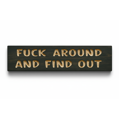 A straight-on product shot of the dark stained, carved wood "Fuck Around and Find Out" sign from Bluegrass Gifts.