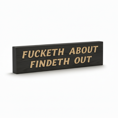 An angled view of the "Fucketh About Findeth Out" sign, showing the deep CNC V-carving and the rich wood grain.