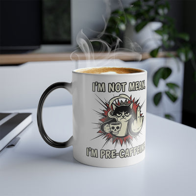 Lifestyle shot of the fully revealed grumpy cat magic mug on a clean white desk, ideal funny gift for a coworker.