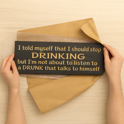 Alt: Unboxing the CNC-carved drinking quote wood sign with kraft paper and bubble wrap.