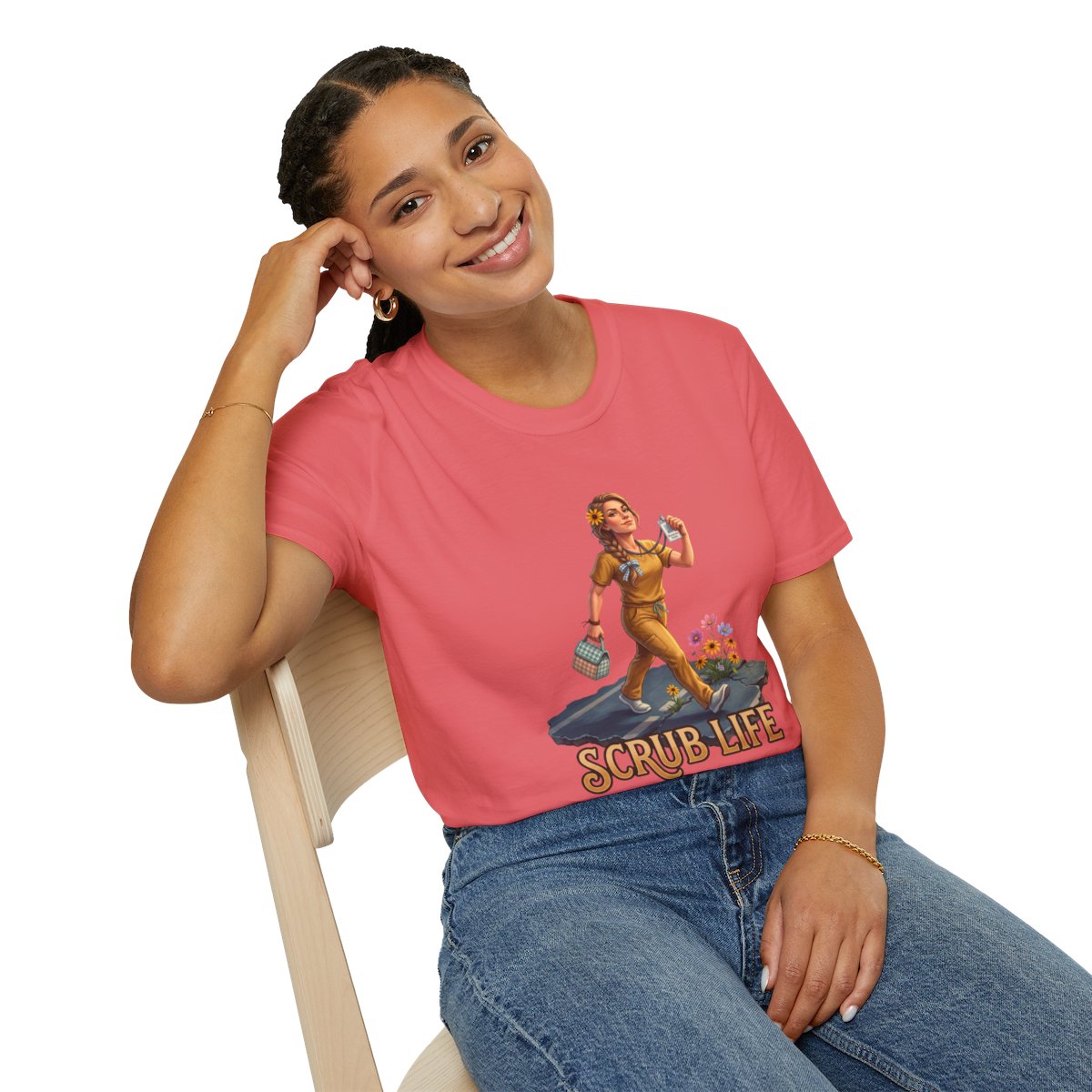 A woman with dark hair leans back in a chair, smiling, wearing a coral Nurse Shirt - Scrub Life tee and blue jeans