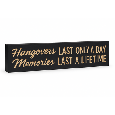 Angled hero shot of the “Hangovers Last Only a Day, Memories Last a Lifetime” CNC-carved wooden wall sign on a white background.
