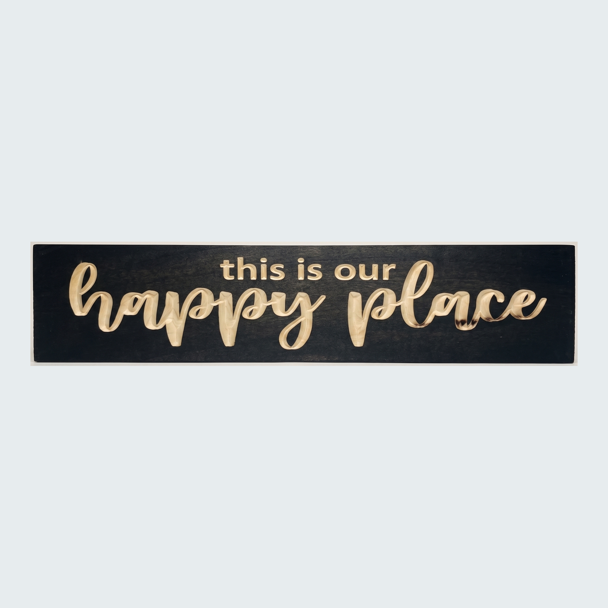 The black and natural wood Camper Sign, "this is our happy place," centered against a plain light gray background