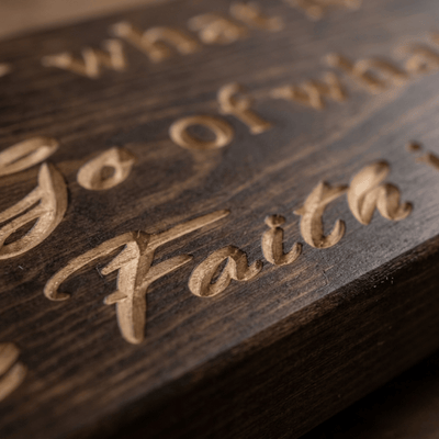 Macro close-up of CNC-carved Have Faith script lettering showing real wood depth on the mindfulness wall sign.