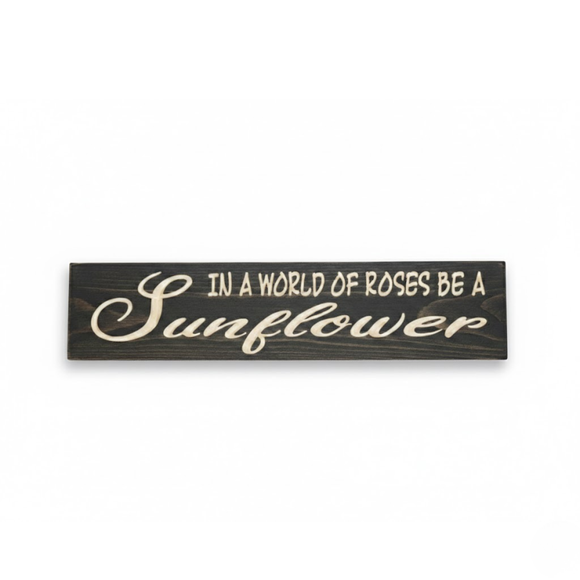 Straight-on hero shot of the In a World of Roses Be a Sunflower carved wood sign featuring high-contrast white lettering on a dark walnut finish by Bluegrass Gifts.