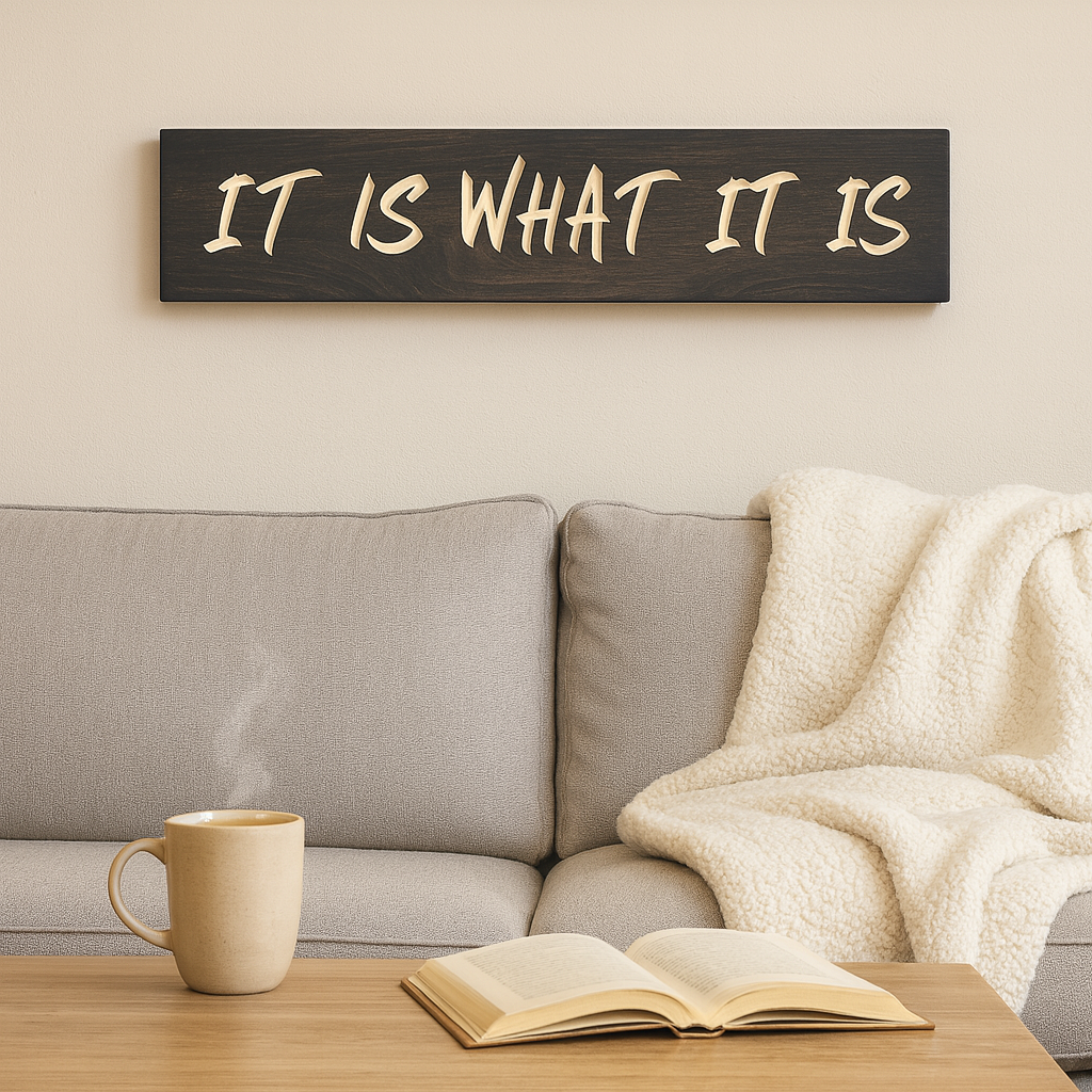 Rustic “It Is What It Is” wooden sign styled above a couch in a farmhouse living room.