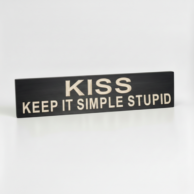 Side-angled view of a solid wood KISS Keep It Simple Stupid plaque, showing the substantial thickness and premium CNC-carved depth of the lettering.