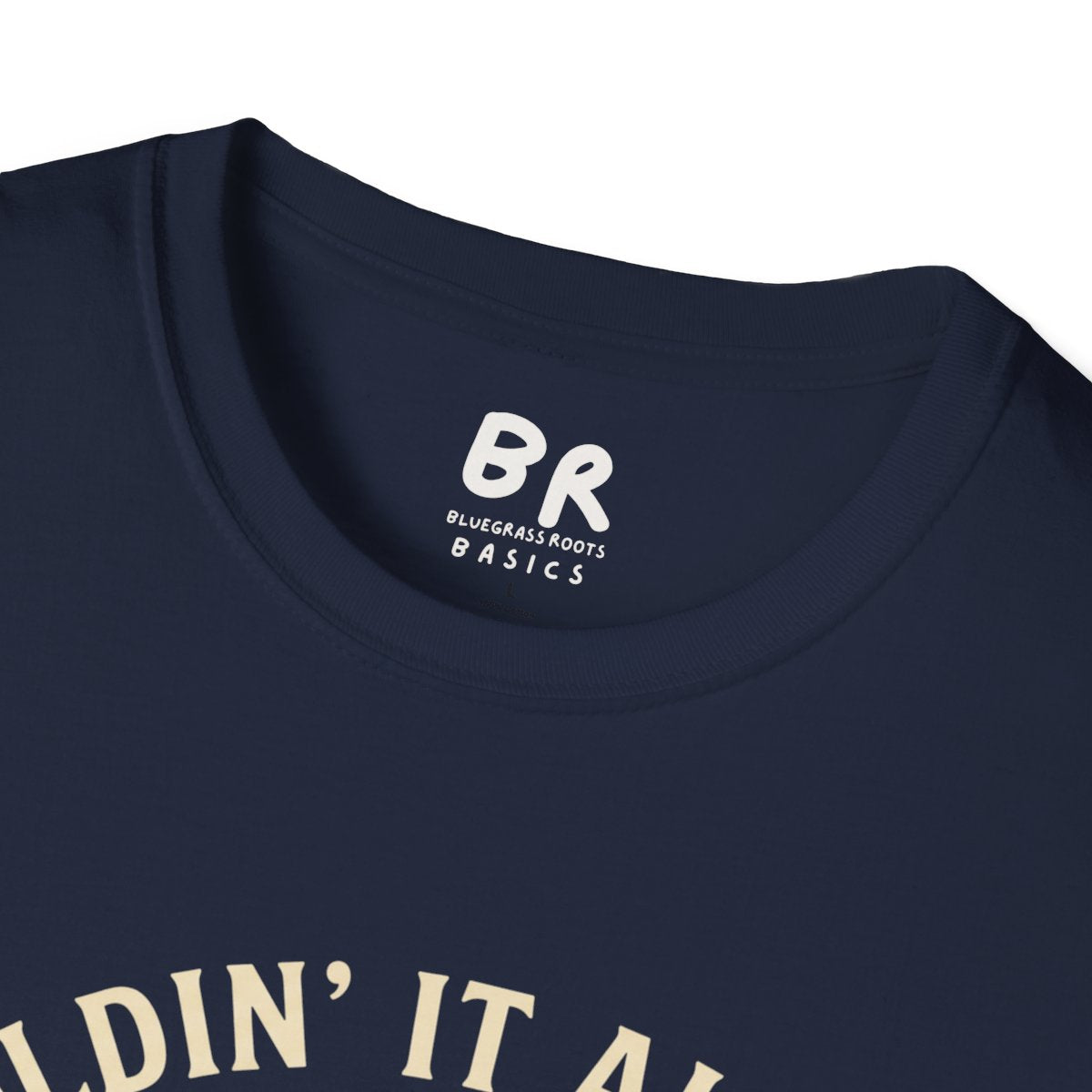 A close-up of the collar tag on a navy "Kentucky Shirt - Holdin' It All Together" tee, showing the BR Bluegrass Roots logo