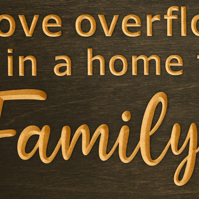 Close-up of engraved lettering on “Love Overflows and Joy Never Ends” Family & Friends wooden wall sign, rustic farmhouse décor.