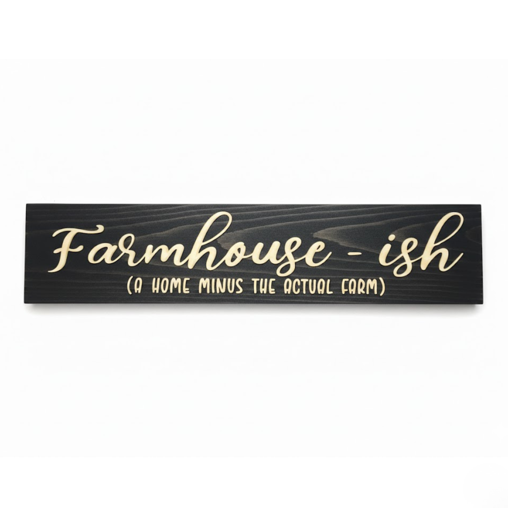 A high-contrast studio shot of the "Farmhouse-ish (A Home Minus The Actual Farm)" sign. Crafted from solid Kentucky hardwood with a midnight ebony finish and natural wood recessed text.