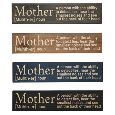 4 variations of the 'Mother Definition' CNC-carved wood sign in Dark Walnut, Early American, Navy Blue, and Black finishes.