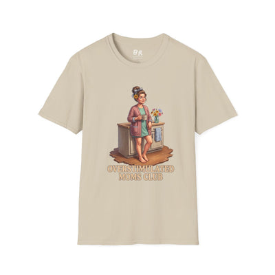A flat lay of a beige Overstimulated Shirt - Overstimulated Moms Club, displaying the full graphic and text on a plain background