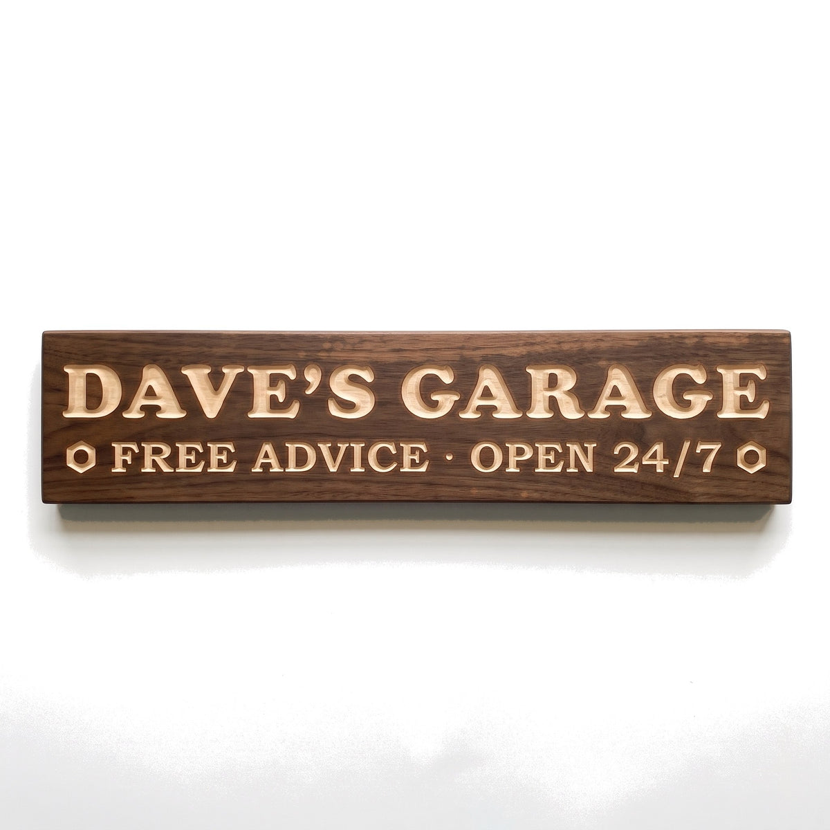 Personalized Dave's Garage sign carved into solid wood in a Dark Walnut finish, straight on, on a white background (studio photo)