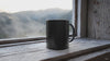 Steam rises as a black mug reveals hidden message when a hot beverage is poured — Bluegrass Gifts heat-changing mug video