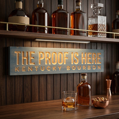 Bourbon Sign — The Proof Is Here | Kentucky Carved Wood — displayed in home bar — Bluegrass Gifts