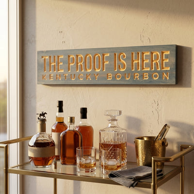 Bourbon Sign — The Proof Is Here | Kentucky Carved Wood — styled on wall — Bluegrass Gifts