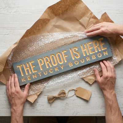 Bourbon Sign — The Proof Is Here | Kentucky Carved Wood — gift-ready packaging — Bluegrass Gifts