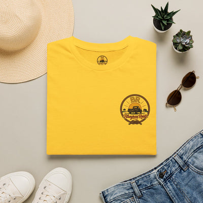 Raised Right Shirt — "Raised Right, Ran Wild, Came Home" Tee in Daisy