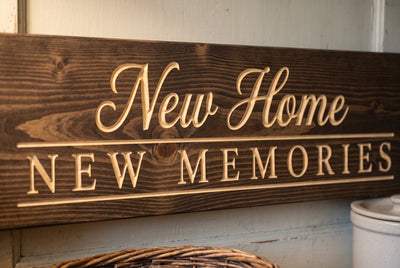 New Home New Memories carved lettering close-up
