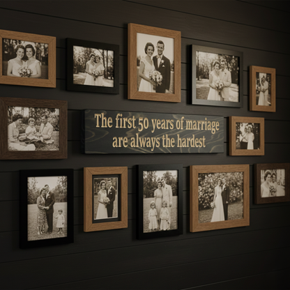 "Funny anniversary wood sign displayed as a centerpiece on a dark shiplap gallery wall surrounded by family wedding photos."