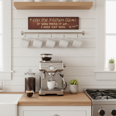 A funny carved wood sign hanging on a white shiplap wall above a modern coffee bar, showcasing it as stylish farmhouse kitchen humor decor.