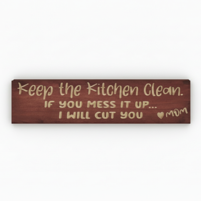 A straight-on product photo of the rustic kitchen humor sign that reads "Keep the Kitchen Clean... I Will Cut You ♥ MOM."