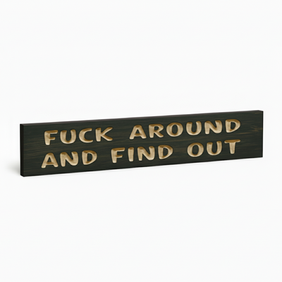 An angled view of the "Fuck Around and Find Out" sarcastic wood decor plaque, showing its thickness and solid construction.